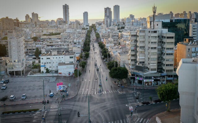 People bike on the empty streets in Netanya, on Yom Kippur, the Day of Atonement, and the holiest of Jewish holidays, October 2, 2025 (Chen Leopold/Flash90)