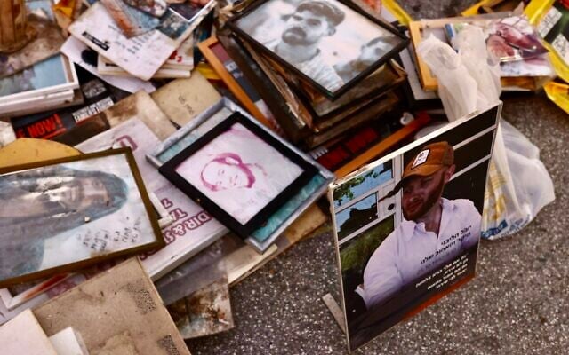 Photographs of victims of the Hamas onslaught of October 7, 2023, are seen as activists clean the memorial for the onslaught at Tel Aviv's Dizengoff Square on October 5, 2025. (Dor Pazuelo/Flash90) Photographs of victims of the Hamas onslaught of October 7, 2023, are seen as activists clean the memorial for the onslaught at Tel Aviv's Dizengoff Square on October 5, 2025. (Dor Pazuelo/Flash90)