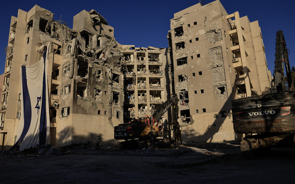 A high-rise residential building in Beersheba that was hit by an Iranian missile on the final day of the war in June, 2025, is demolished, on October 8, 2025. (Tsafrir Abayov/Flash90)
