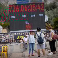 Visitors at Hostage Square in Tel Aviv on October 12, 2025. (Miriam Alster/FLASH90)