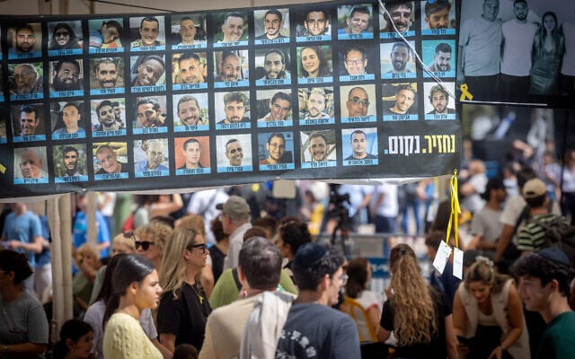 Visitors at Hostage Square in Tel Aviv on October 12, 2025. (Miriam Alster/FLASH90)