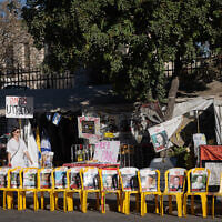 Chairs with photographs of Israeli hostages, some who were released a few days ago, and some who's bodies are still held in Hamas captivity, seen in Jerusalem, October 15, 2025. (Chaim Goldberg/Flash90)