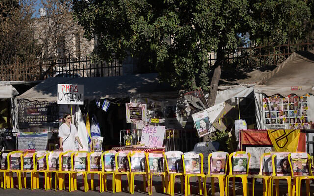Chairs with photographs of Israeli hostages, some who were released a few days ago, and some who's bodies are still held in Hamas captivity, seen in Jerusalem, October 15, 2025. (Chaim Goldberg/Flash90)
