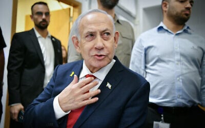 Prime Minister Benjamin Netanyahu arrives at the Tel Aviv District Court for his corruption trial, October 15, 2025. (Reuven Kastro/POOL)