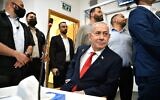 Prime Minister Benjamin Netanyahu sits at the Tel Aviv District Court ahead of his testimony in the corruption trial against him, October 15, 2025. (Reuven Kastro/POOL)