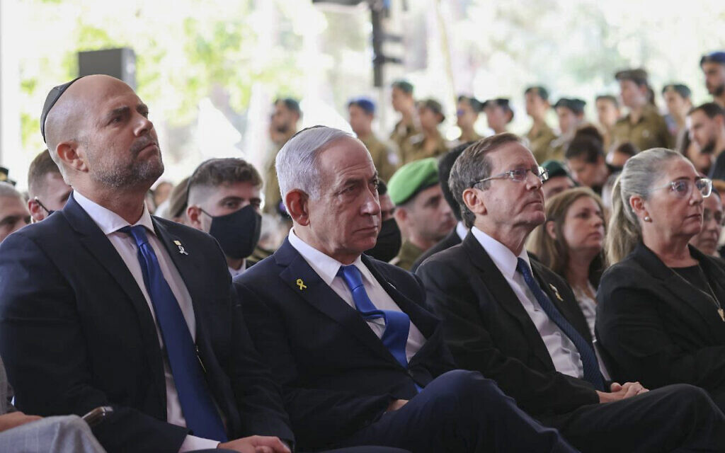 Speaker of the Knesset Amir Ohana, Prime Minister Benjamin Netanyahu and President Isaac Herzog at a state ceremony marking the anniversary of the Hamas terrorist attack on October 7, at Mount Herzl military cemetery in Jerusalem, on October 16, 2025. (Alex Kolomoisky/POOL)