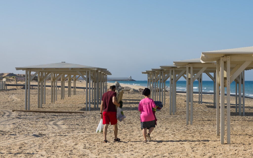 Visitors at Zikim Beach, near the border with the Gaza Strip, after it was reopened to the public on October 16, 2025. (Liron Moldovan/Flash90)