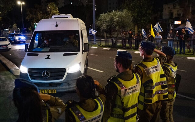 Israeli citizens and soldiers pay their respects as a convoy carrying two bodies purported to be of two hostages held by Hamas arrive at the Abu Kabir forensic institute in Tel Aviv, on October 16, 2025. (onatan Sindel/Flash90) Israeli citizens and soldiers pay their respects as a convoy carrying two bodies purported to be of two hostages held by Hamas arrive at the Abu Kabir forensic institute in Tel Aviv, on October 16, 2025. (onatan Sindel/Flash90)