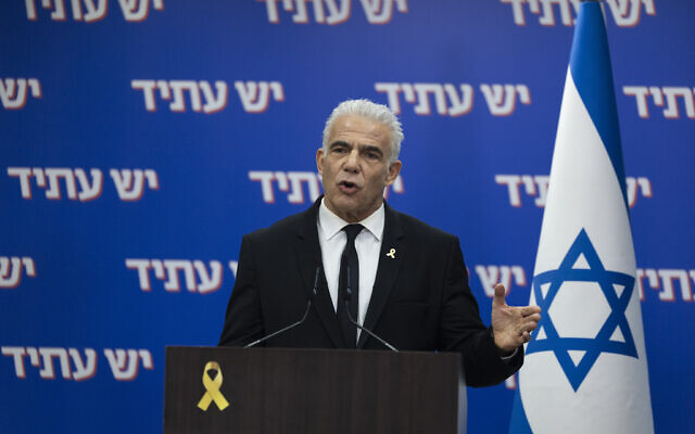 Opposition leader and Yesh Atid party chair Yair Lapid leads a faction meeting at the Knesset on October 20, 2025. (Chaim Goldberg/Flash90)