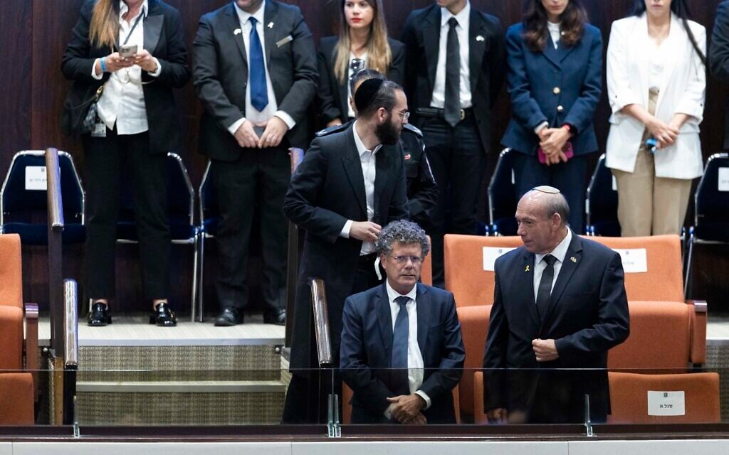 Supreme Court President Isaac Amit (first row, left) attends a plenary session of the opening day of the winter session at the Knesset in Jerusalem, on October 20, 2025. (Chaim Goldberg/Flash90)