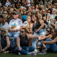 Family and friends attend the funeral ceremony of slain hostage Tamir Adar at Kibbutz Nir Oz on October 23, 2025. (Chaim Goldberg/Flash90)