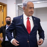 Prime Minister Benjamin Netanyahu arrives at the Tel Aviv District Court for a hearing in his corruption trial, October 28, 2025 (Miriam Alster/Flash90)
