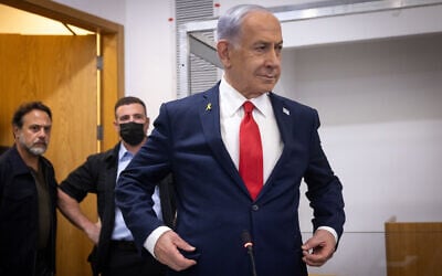 Prime Minister Benjamin Netanyahu arrives at the Tel Aviv District Court for a hearing in his corruption trial, October 28, 2025 (Miriam Alster/Flash90)