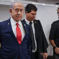 Prime Minister Benjamin Netanyahu arrives at the Tel Aviv District Court for a hearing in his corruption trial, October 28, 2025. (Miriam Alster/Flash90)