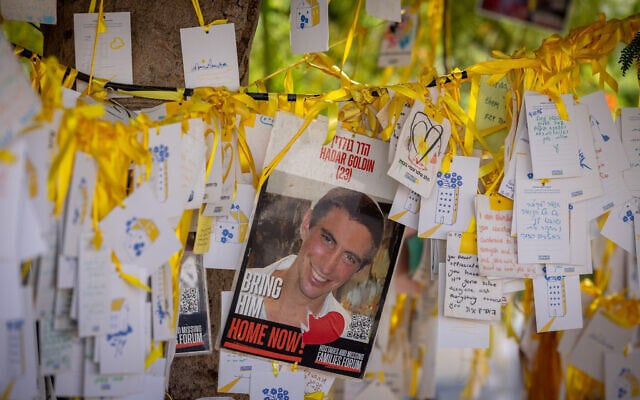 A poster of Hadar Goldin, the Givati commander killed in combat in Gaza in 2014, his poster at Tel Aviv's Hostages Square on October 28, 2025. (Miriam Alster/Flash90)