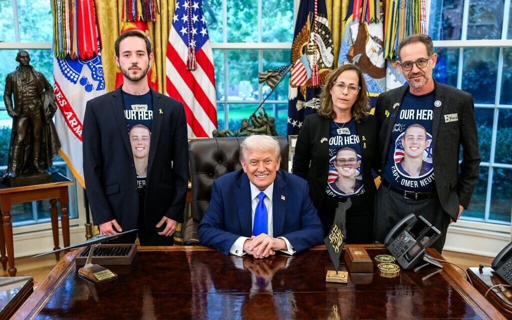 US President Donald Trump, sitting, hosts the family of slain Israeli-American hostage Omer Neutra on the second anniversary of his kidnapping by Hamas, at the Oval Office of the White House in Washington, DC, October 7, 2025. (White House)