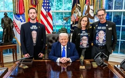 US President Donald Trump, sitting, hosts the family of slain Israeli-American hostage Omer Neutra on the second anniversary of his kidnapping by Hamas, at the Oval Office of the White House in Washington, DC, October 7, 2025. (White House)
