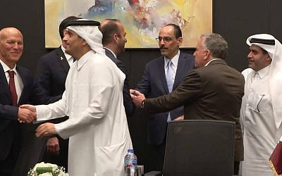 Israeli negotiator Nitzan Alon (far left) shakes hands with Qatar's Prime Minister Mohammed bin Abdulrahman bin Jassim Al Thani in a photo indicating success in the mediated Israel-Hamas negotiations on a Gaza hostage-ceasefire agreement in Sharm el-Sheikh, in the early hours of October 9, 2025. Second from right with back to camera is US special Middle East envoy Steve Witkoff. (Telegram / used in accordance with clause 27a of the copyright law) Israeli negotiator Nitzan Alon (far left) shakes hands with Qatar's Prime Minister Mohammed bin Abdulrahman bin Jassim Al Thani in a photo indicating success in the mediated Israel-Hamas negotiations on a Gaza hostage-ceasefire agreement in Sharm el-Sheikh, in the early hours of October 9, 2025. Second from right with back to camera is US special Middle East envoy Steve Witkoff. (Telegram / used in accordance with clause 27a of the copyright law)