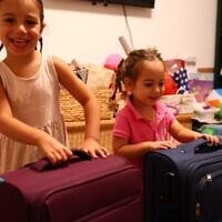The daughters of hostage Omri Miran, Roni (4), and Alma (2), prepare for his anticipated return, October 12, 2025. (Lishay Miran-Lavi/X)