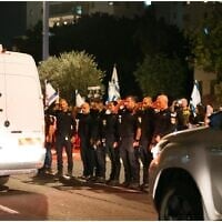 Police salute a van carrying the remains of four hostages as they are being taken for identification on October 13, 2025 (Israel Police)
