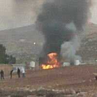 A burning home, allegedly torched by settlers, at the Bedouin community of al-Ara'ara, near Mukhmas, west of Ramallah, in the West Bank, October 25, 2025. (Courtesy/Torat Tzedek)