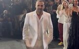 Former hostage Eli Sharabi participates in the opening night of Tel Aviv Fashion Week on October 26, 2025 (Courtesy)