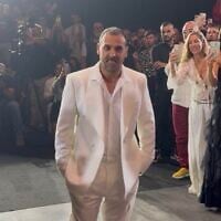 Former hostage Eli Sharabi participates in the opening night of Tel Aviv Fashion Week on October 26, 2025 (Courtesy)