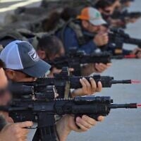 A first responder team from Kibbutz Netiv Ha’asara, near the Gaza border, practices long-distance shooting during a fifth training session at the IDF's Tze'elim base, September 25, 2025. (Ari Briggs, Magen48)