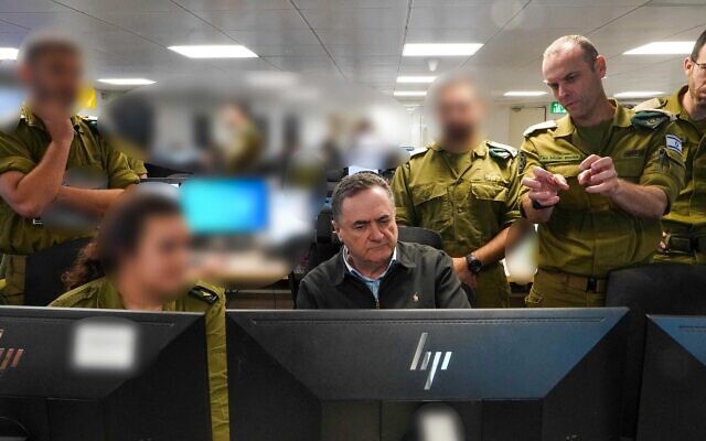 Defense Minister Israel Katz and IDF Intelligence Directorate chief Maj. Gen. Shlomi Binder are seen at a command center, in a photo issued on October 16, 2025. (Ariel Hermoni/Defense Ministry)