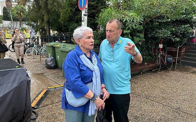 Tel Aviv mayor Ron Huldai, right, talks with a woman near Hostages Square in Tel Aviv on October 9, 2025. (Ben Sales/Times of Israel) Tel Aviv mayor Ron Huldai, right, talks with a woman near Hostages Square in Tel Aviv on October 9, 2025. (Ben Sales/Times of Israel)