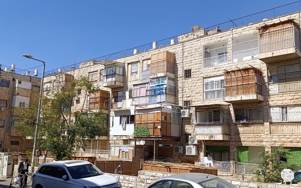 Sukkahs around the Meah Shearim neighborhood in Jerusalem, October 8, 2025 (Zev Stub/Times of Israel)