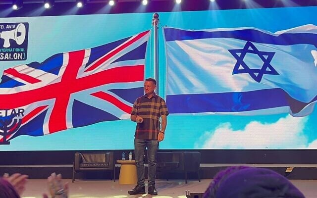 UK far-right, anti-Islam activist Tommy Robinson speaks in Tel Aviv on October 18, 2025 (Stav Levaton / Times of Israel)