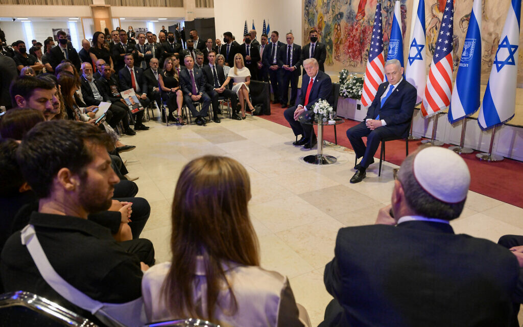 Prime Minister Benjamin Netanyahu and US President Donald Trump meet with hostage families and survivors of captivity in the Knesset on October 13, 2025 (Maayan Toaf / GPO)