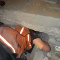 Gazan emergency responders attempt to rescue someone trapped beneath rubble following an Israeli airstrike on Gaza City on October 9, 2025. (Screenshot/Telegram)