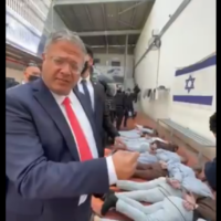 A screengrab of a video posted to National Security Minister Itamar Ben Gvir's Telegram page on October 31, 2025, showing him next to tied-up Palestinian prisoners. (Telegram)