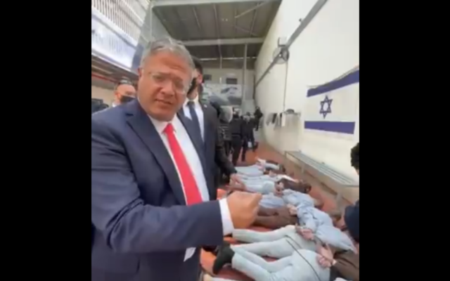 A screengrab of a video posted to National Security Minister Itamar Ben Gvir's Telegram page on October 31, 2025, showing him next to tied-up Palestinian prisoners. (Telegram)