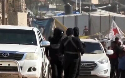 Screengrab of Al-Araby TV footage reportedly showing Hamas members and Red Cross vehicles in Rafah, southern Gaza, October 25, 2025. (Screenshot/Al-Araby) Screengrab of Al-Araby TV footage reportedly showing Hamas members and Red Cross vehicles in Rafah, southern Gaza, October 25, 2025. (Screenshot/Al-Araby)