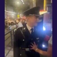 A man wearing a Nazi uniform assaults a woman outside of a bar in downtown Athens, Georgia. (Screenshot via JTA)