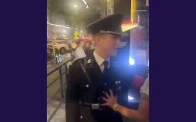 A man wearing a Nazi uniform assaults a woman outside of a bar in downtown Athens, Georgia. (Screenshot via JTA)
