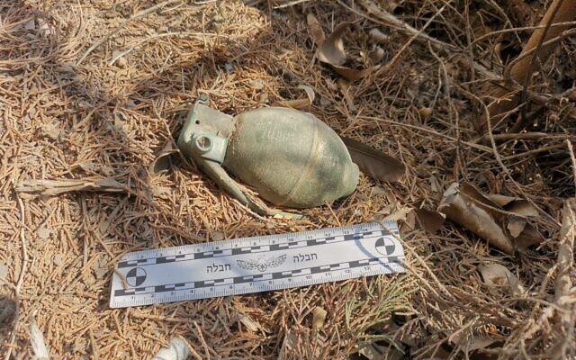 A grenade left by Hamas attackers on Kibbutz Be'eri and found on October 5, 2025. (Israel Police) A grenade left by Hamas attackers on Kibbutz Be'eri and found on October 5, 2025. (Israel Police)