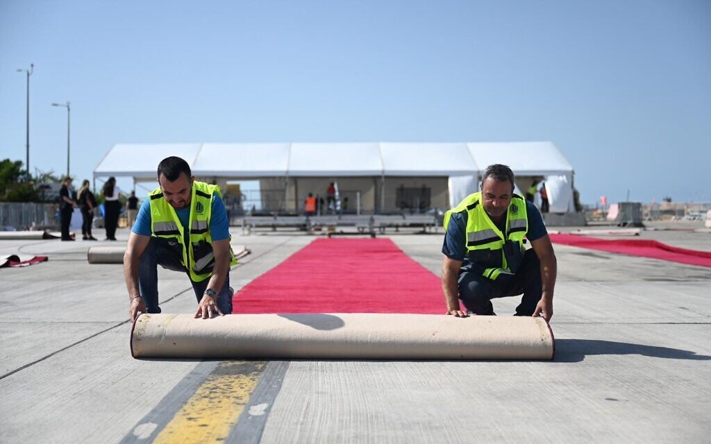 Workers prepare a red carpet a day ahead of US President Donald Trump's arrival to Ben Gurion International Airport near Tel Aviv on October 12, 2025. (Defense Ministry)
