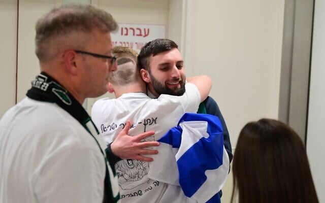Matan Angrest with his family at the hospital following his release from captivity on  October 13, 2025. (Government Press Office)