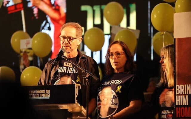 Ronen and Orna Neutra, parents of Omer Neutra, killed on October 7, 2023, his body still held in Gaza, at the October 18, 2025 rally at Tel Aviv's Hostages Square. (Tzachi Dovrat/Israeli Pro-Democracy Protest Movement)