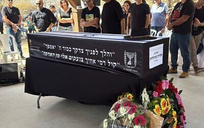 Loved ones gather around the casket of Eliyahu Margalit, at his funeral in Kibbutz Nir Oz on October 20, 2025. Terrorists murdered Margalit on October 7, 2023, and held his body in Gaza for two years. (Hostages and Missing Families Forum) Loved ones gather around the casket of Eliyahu Margalit, at his funeral in Kibbutz Nir Oz on October 20, 2025. Terrorists murdered Margalit on October 7, 2023, and held his body in Gaza for two years. (Hostages and Missing Families Forum)