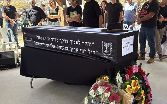 Loved ones gather around the casket of Eliyahu Margalit, at his funeral in Kibbutz Nir Oz on October 20, 2025. Terrorists murdered Margalit on October 7, 2023, and held his body in Gaza for two years. (Hostages and Missing Families Forum) Loved ones gather around the casket of Eliyahu Margalit, at his funeral in Kibbutz Nir Oz on October 20, 2025. Terrorists murdered Margalit on October 7, 2023, and held his body in Gaza for two years. (Hostages and Missing Families Forum)