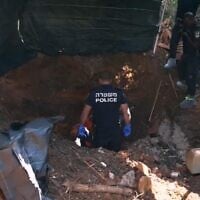 Police seen searching for the body of a Holocaust survivor who was allegedly buried in the backyard of her daughter's home on a picture released on October 20, 2025 (Israel Police)