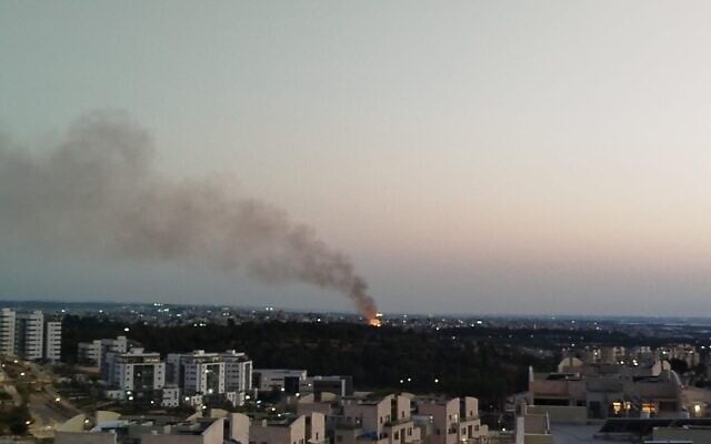 A fire lit to burn waste in the West Bank, as seen from the northern Israeli neighborhood of Harish earlier this year. (Dolev Hilell)
