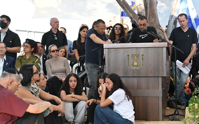 At the October 27, 2025, Kibbutz Be'eri burial for Yossi Sharabi, after his body was brought back from capitivity in Gaza, as his brother, former hostage Eli Sharabi, center, eulogizes him. (Paulina Patimer/Hostages Forum)