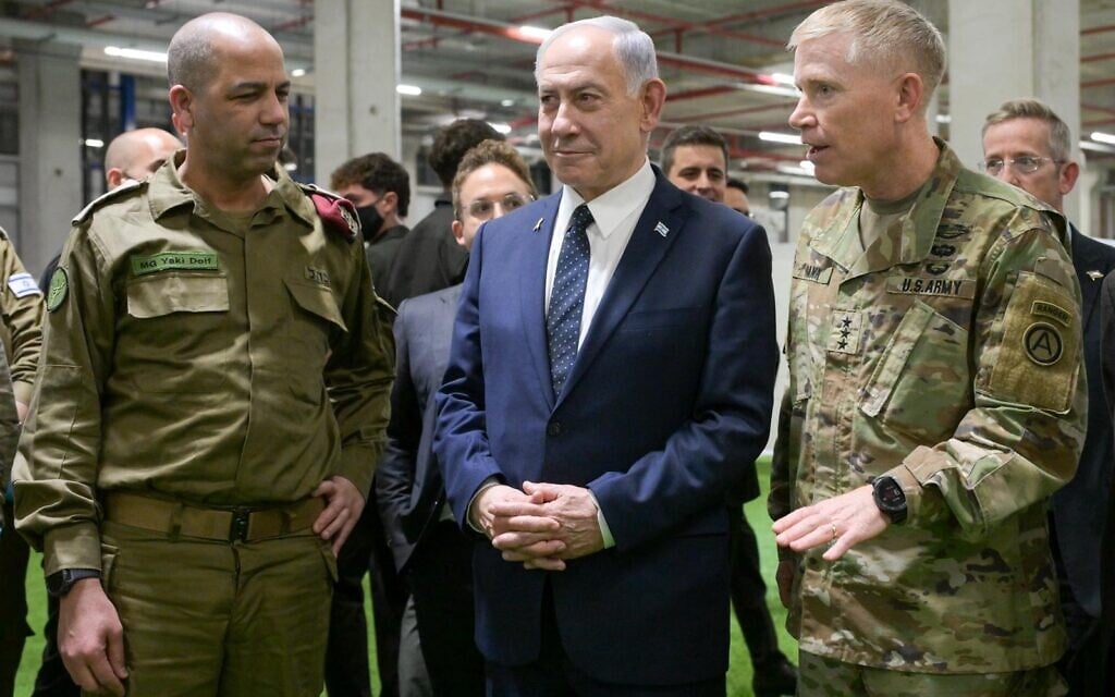 Prime Minister Benjamin Netanyahu visits the Civil-Military Coordination Center in Kiryat Gat on October 29, 2025, meeting IDF Maj. Gen. Yaki Dolf (left) and US Lt. Gen. Patrick Frank (right). (Maayan Toaf/GPO)