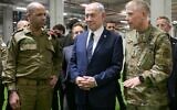 Prime Minister Benjamin Netanyahu visits the Civil-Military Coordination Center in Kiryat Gat on October 29, 2025, meeting  IDF Maj. Gen. Yaki Dolf (left) and US Lt. Gen. Patrick Frank (right). (Maayan Toaf/GPO)